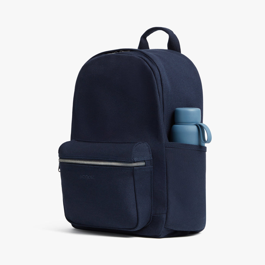 Abyss Blue | Side exterior pocket view of Gesso Backpack in Abyss Blue