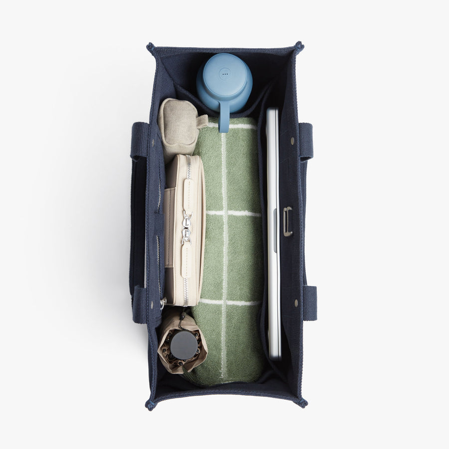 Abyss Blue | Interior view of Gesso Tote in Abyss Blue with folio kit and water bottle