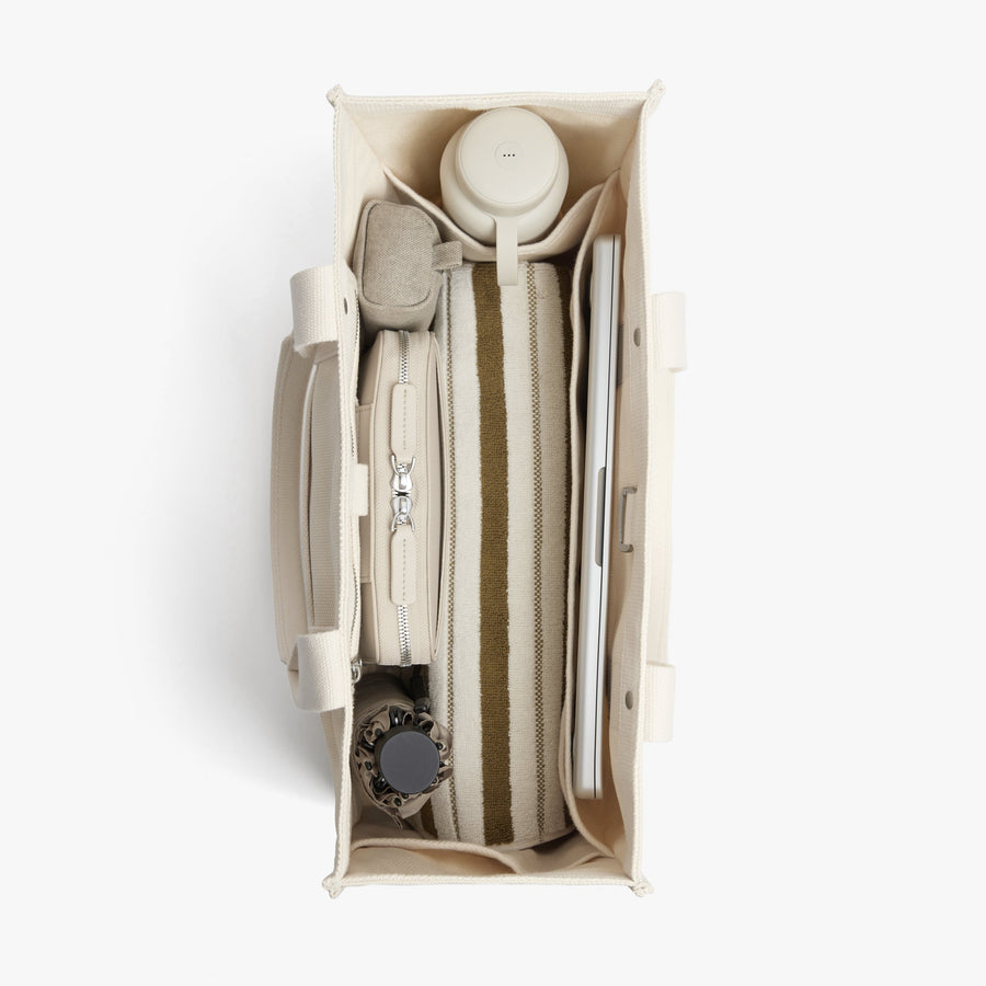 Ecru | Interior view of Gesso Tote in Ecru with folio kit and water bottle