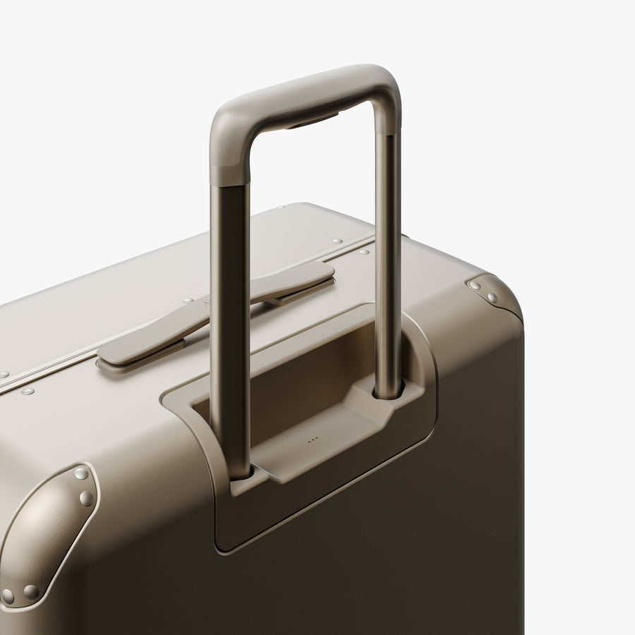 Champagne | Extended luggage handle view of Hybrid Check-In Medium in Champagne