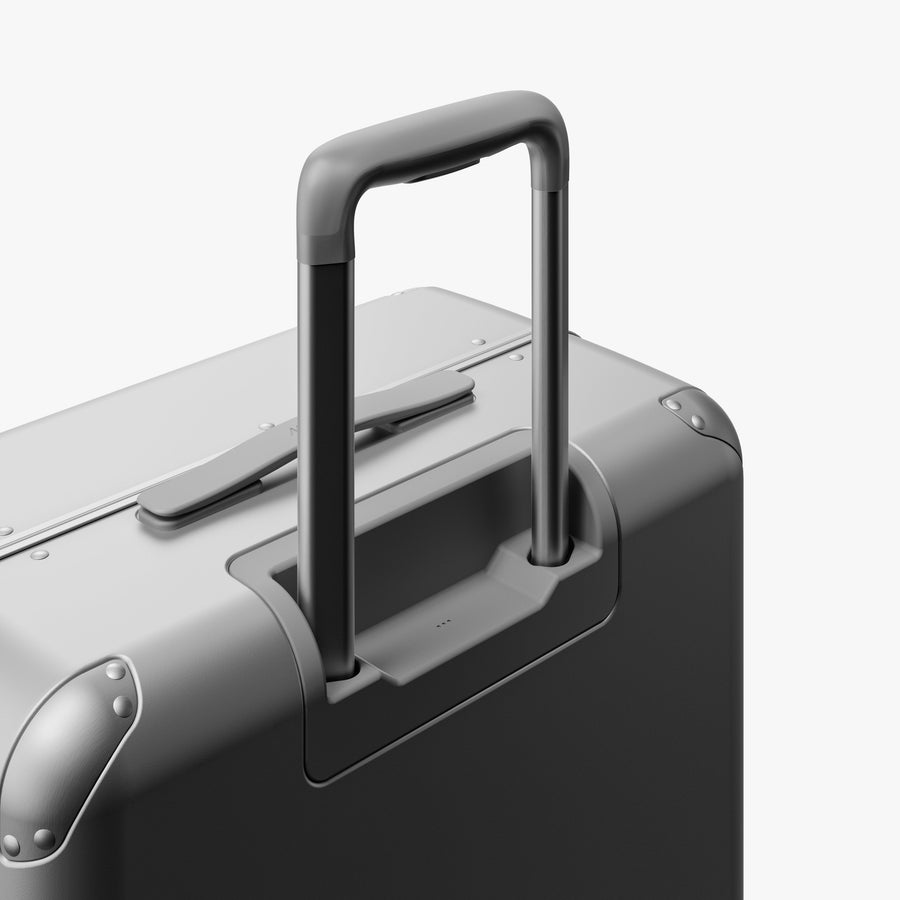 Silver | Extended luggage handle view of Hybrid Check-In Medium in Silver