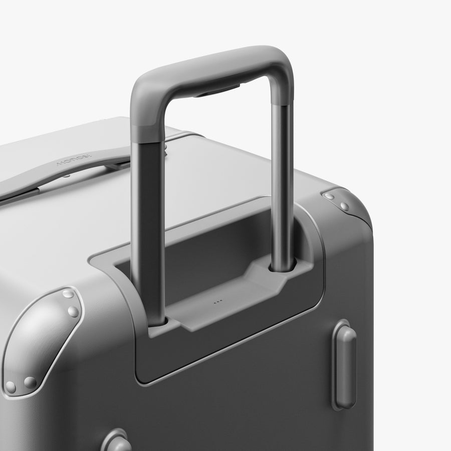 Silver | Extended luggage handle view of Hybrid Trunk in Silver