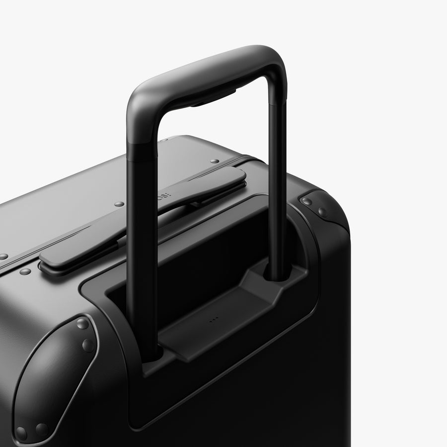 Obsidian | Extended luggage handle view of Hybrid Carry-On in Obsidian
