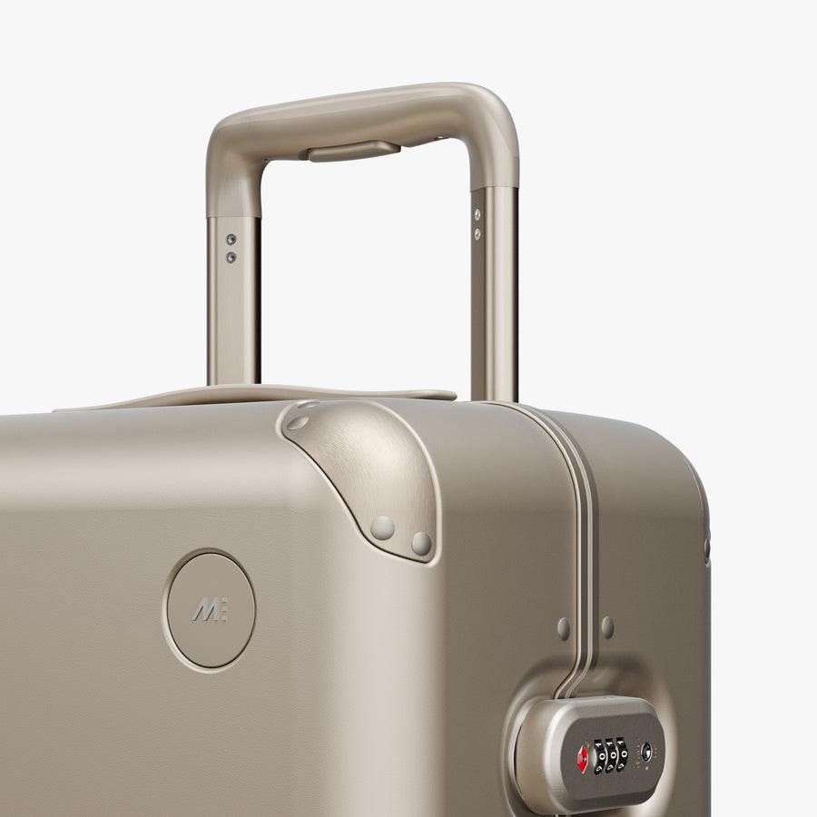 Champagne | Luggage handle view of Hybrid Carry-On Plus in Champagne