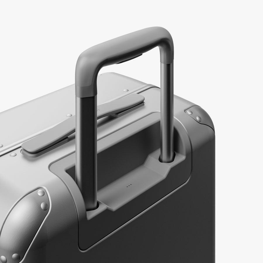 Silver | Extended luggage handle view of Hybrid Carry-On Plus in Silver