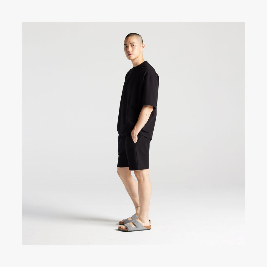 Black | Full body side view of man in Kyoto Short Sleeve in Black