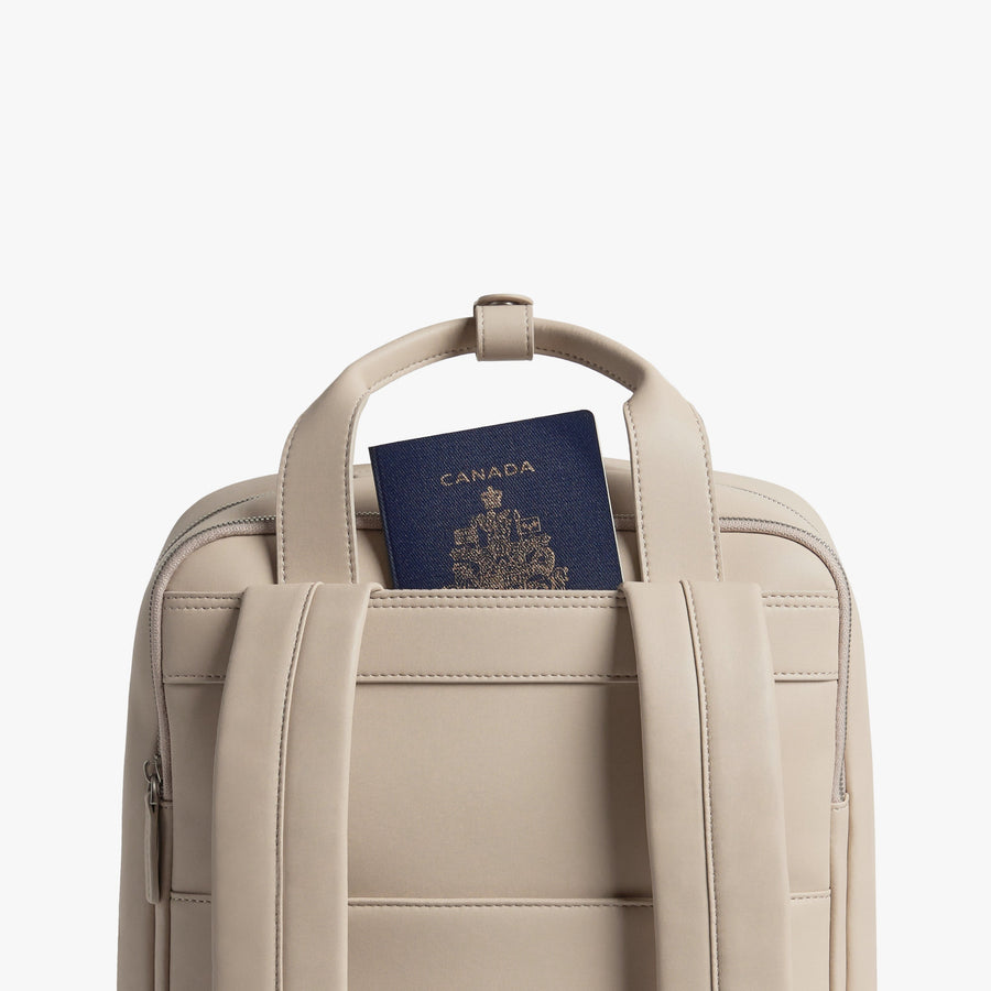 Ivory (Vegan Leather) | Handle view of Metro Backpack Ivory