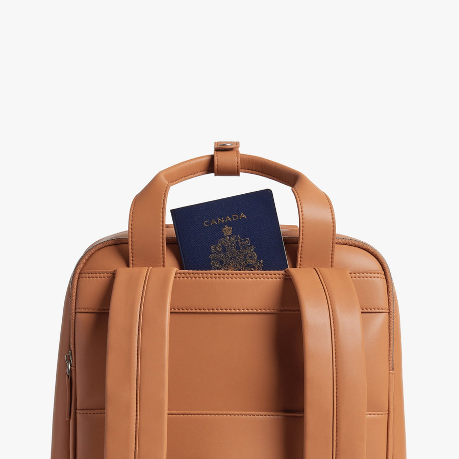 Saddle Tan (Vegan Leather) | Handle view of Metro Backpack Saddle Tan