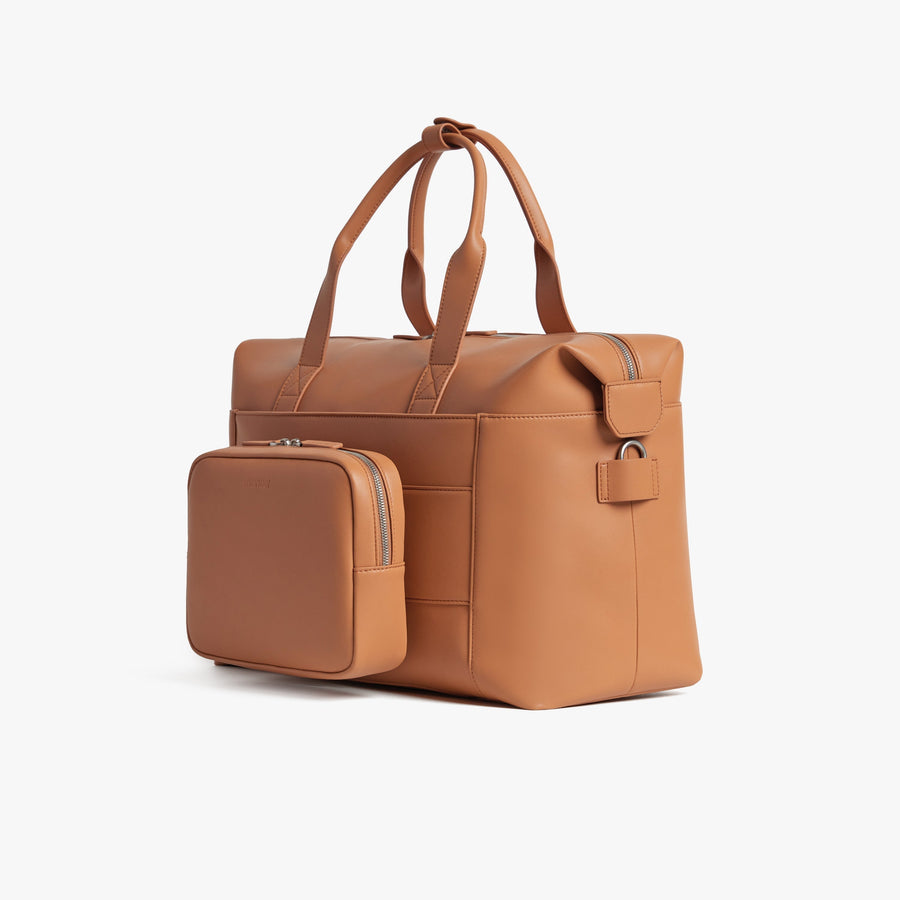 Saddle Tan (Vegan Leather) | Angled view of Metro Duffel in Saddle Tan