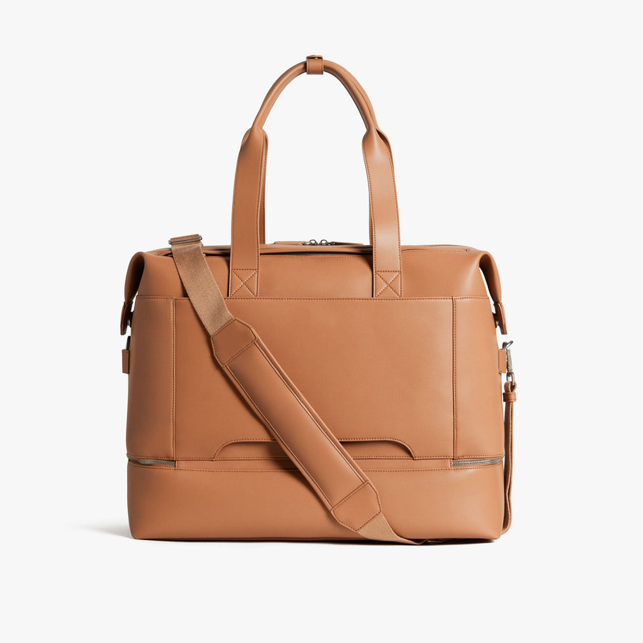 Saddle Tan (Vegan Leather) | Back view with strap of Metro Weekender in Saddle Tan