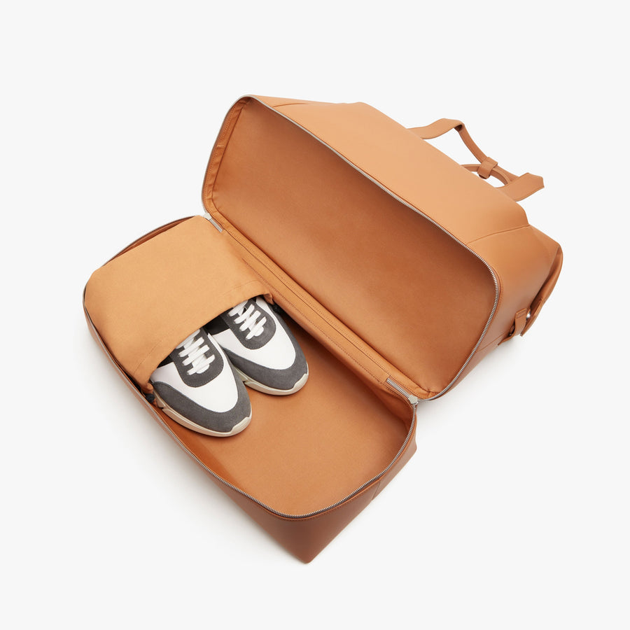 Saddle Tan (Vegan Leather) | Shoe compartment view of Metro Weekender in Saddle Tan