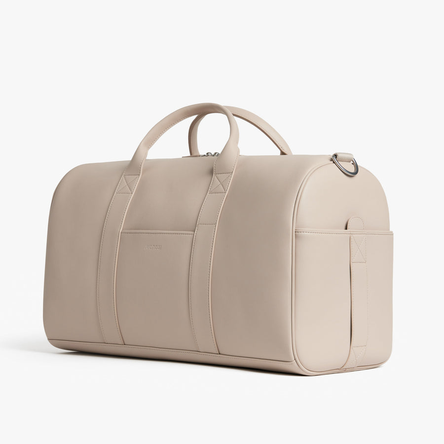 Ivory (Vegan Leather) | Angled view of Metro Carry-All Duffel in Ivory