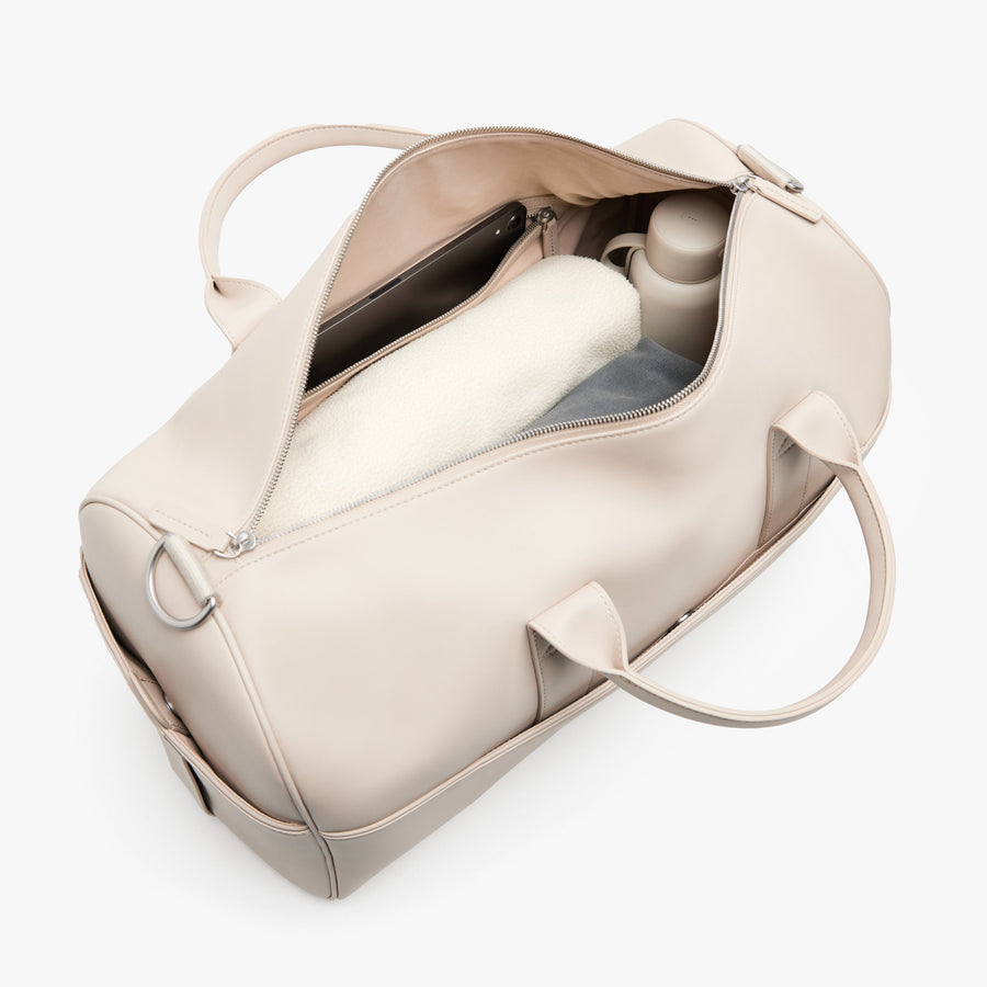 Ivory (Vegan Leather) | Angled view of Metro Carry-All Duffel in Ivory