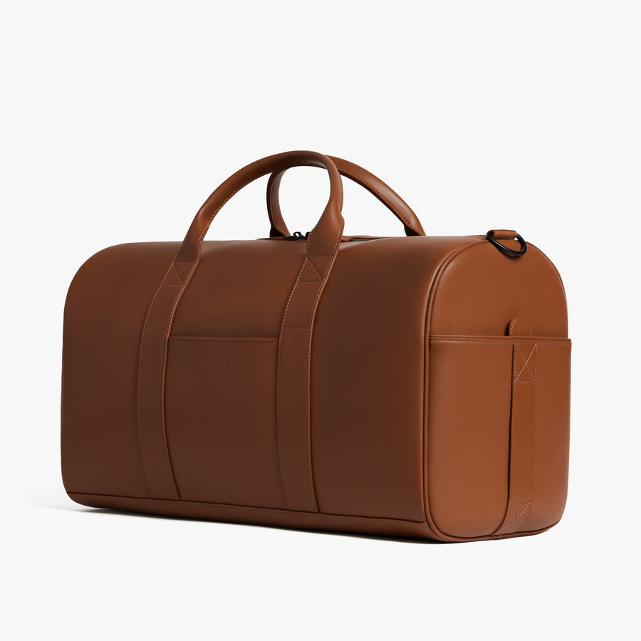 Mahogany (Vegan Leather) | Angled view of Metro Carry-All Duffel in Mahogany