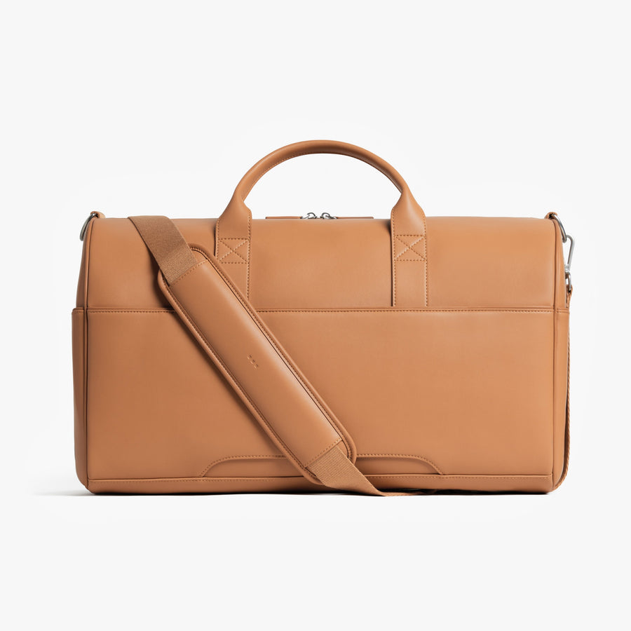 Saddle Tan (Vegan Leather) | Back view of Metro Carry-All Duffel Saddle Tan