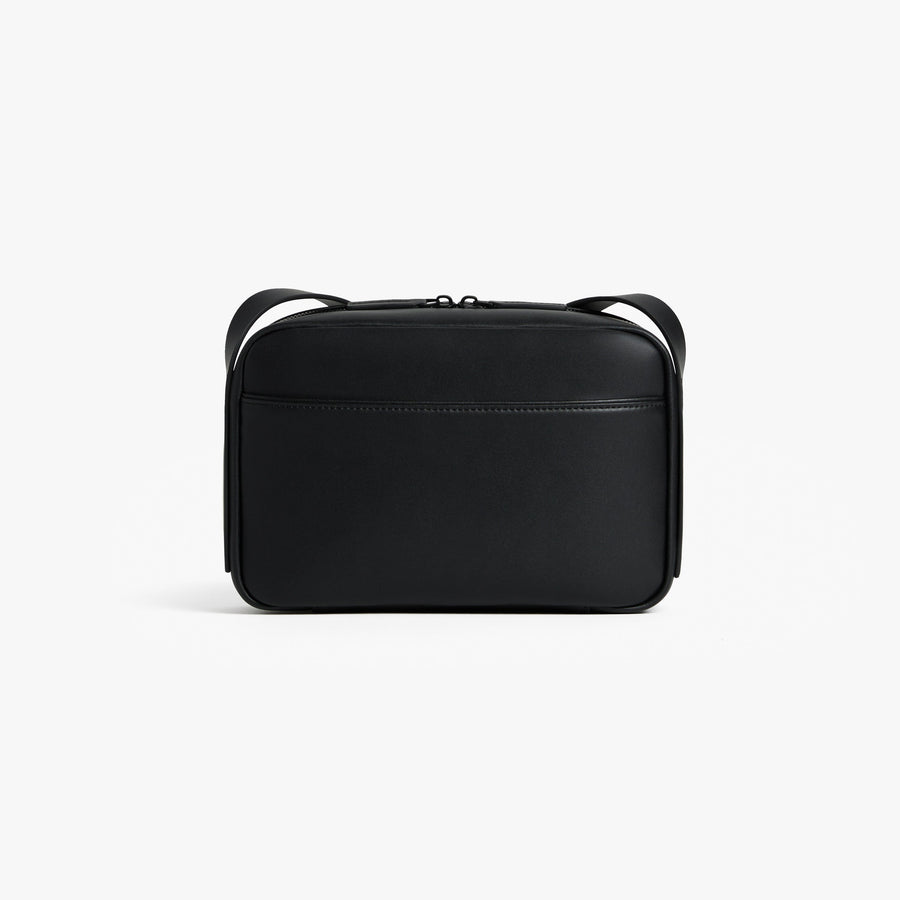 Carbon Black (Vegan Leather) | Back view of Metro Crossbody Carbon Black