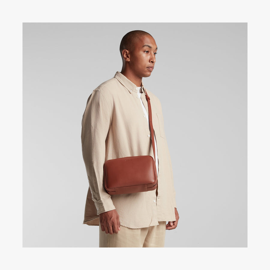 Mahogany (Vegan Leather) | Angled view of Metro Crossbody in Mahogany