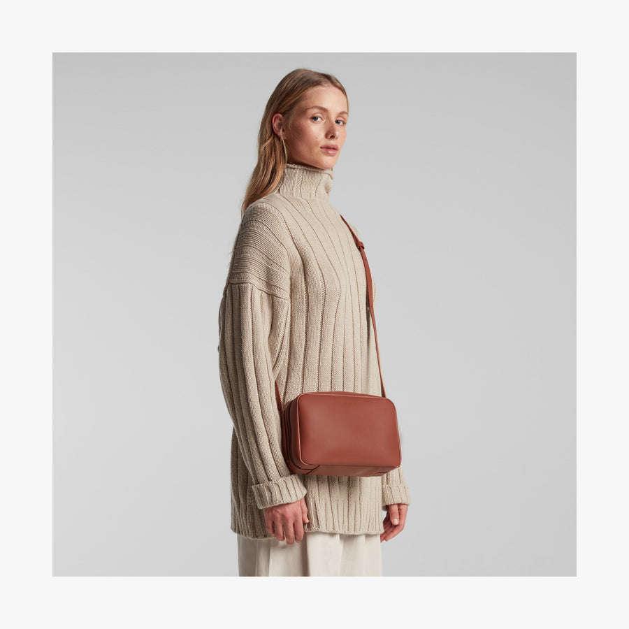 Mahogany (Vegan Leather) | Angled view of Metro Crossbody in Mahogany