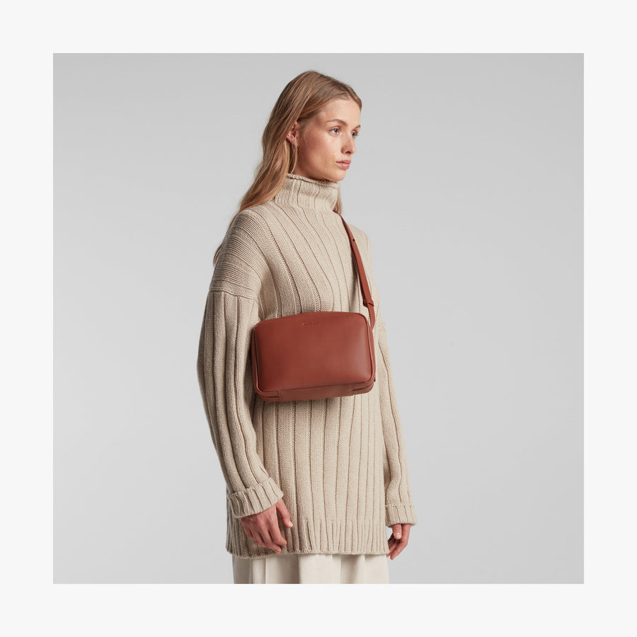 Mahogany (Vegan Leather) | Angled view of Metro Crossbody in Mahogany