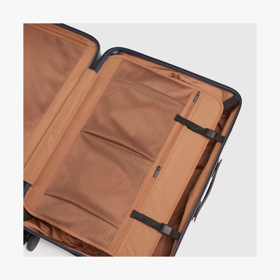 Arles Blue (Glossy) | Compression Pocket inside view of Check-In Large in Arles Blue