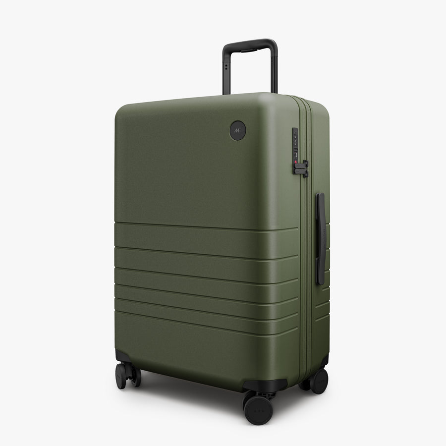 Olive Green | Angled view of Expandable Check-In Medium in Olive Green