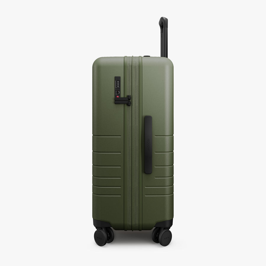 Olive Green | Side view of Expandable Check-In Medium in Olive Green