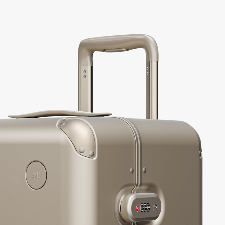 Champagne | Luggage handle view of Hybrid Trunk Medium in Champagne