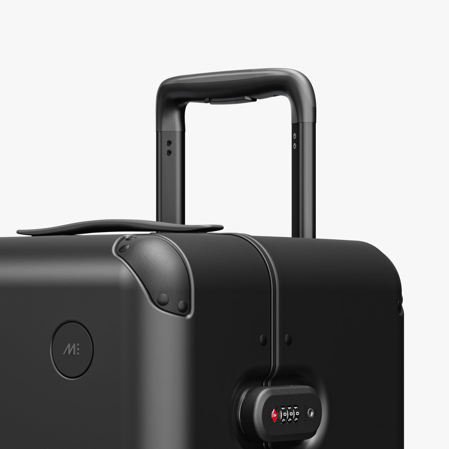 Obsidian | Luggage handle view of Hybrid Trunk Medium Obsidian