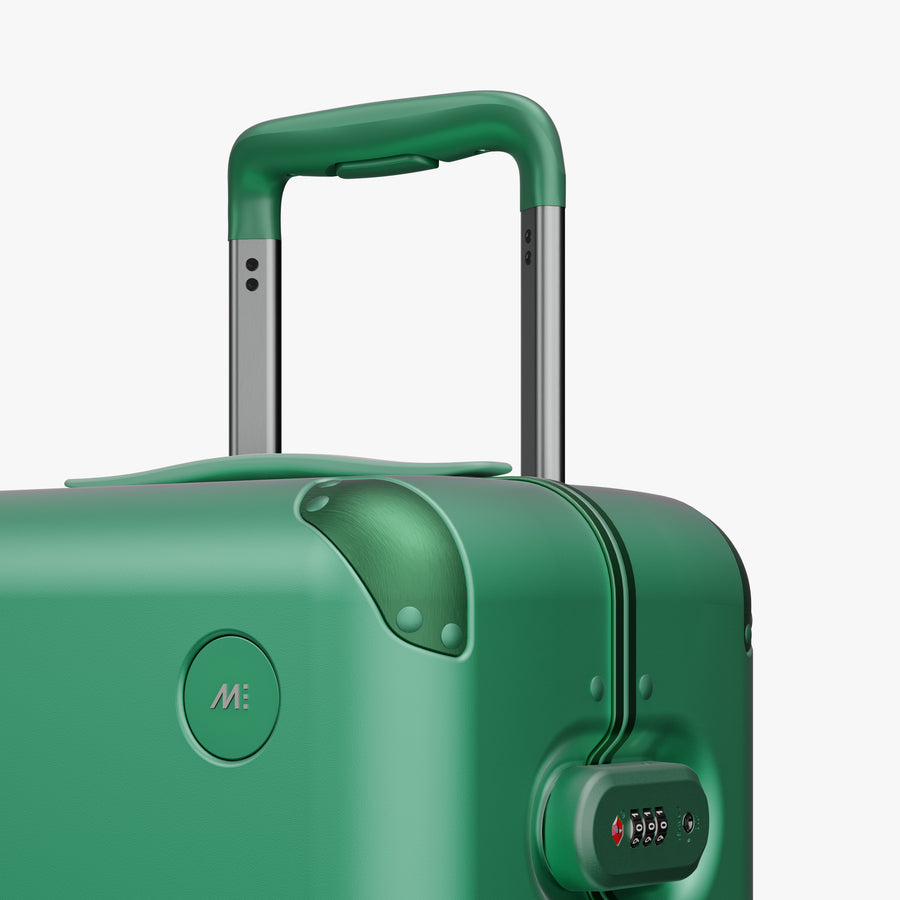 Jungle Green | Close-up view of the logo detail on the Hybrid Carry-On in Jungle Green