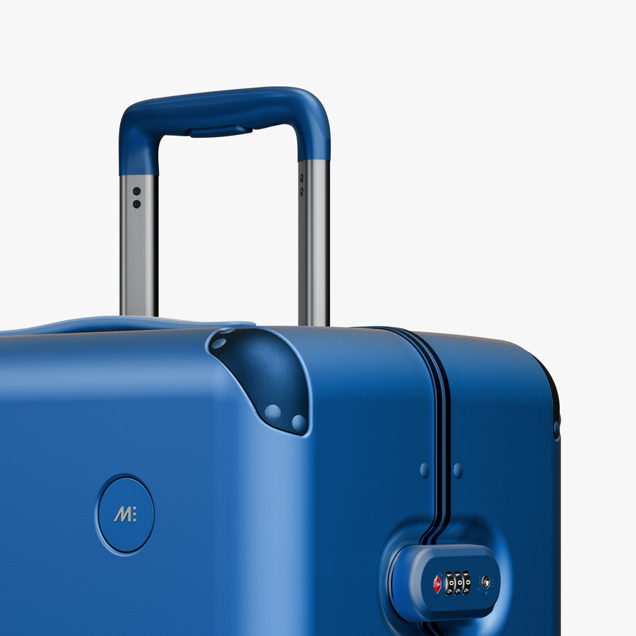 Coastal Blue | Close-up view of the logo detail on the Hybrid Check-In Large in Coastal Blue