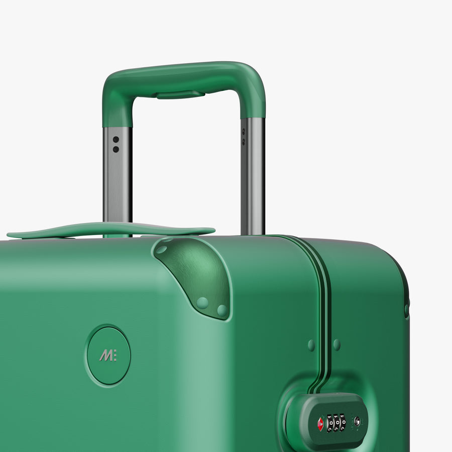 Jungle Green | Close-up view of the logo detail on the Hybrid Check-In Medium in Jungle Green