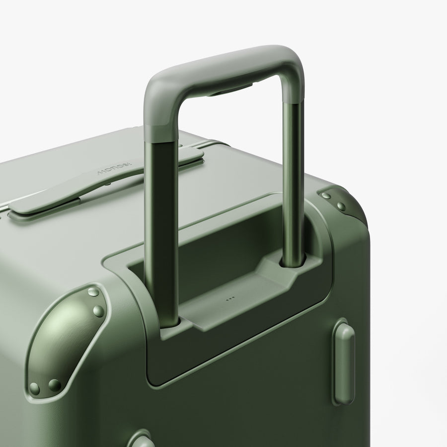 Mint | Extended luggage handle view of Hybrid Trunk Medium in Mint