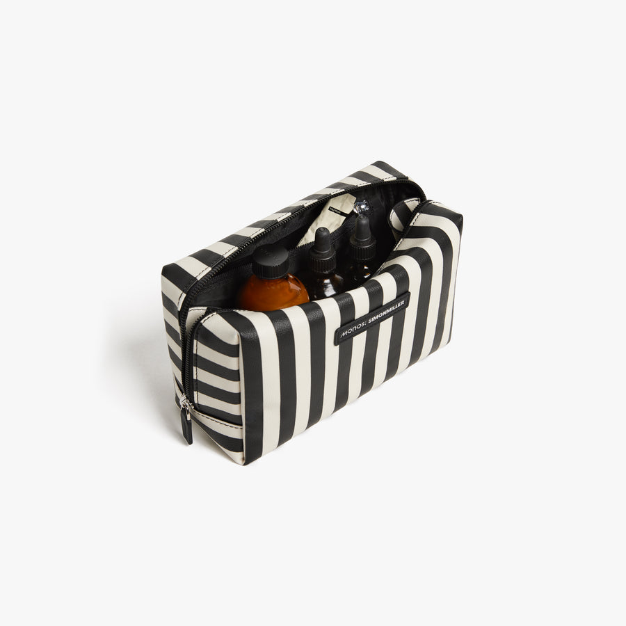 Large/ Poplin Stripe Black | Front angled view of the opened large Metro Toiletry Case in Poplin Stripe Black, showing travel essentials stored inside