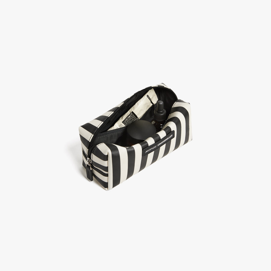 Small / Poplin Stripe Black | Front angled view of the opened small Metro Toiletry Case in Poplin Stripe Black, showing travel essentials stored inside