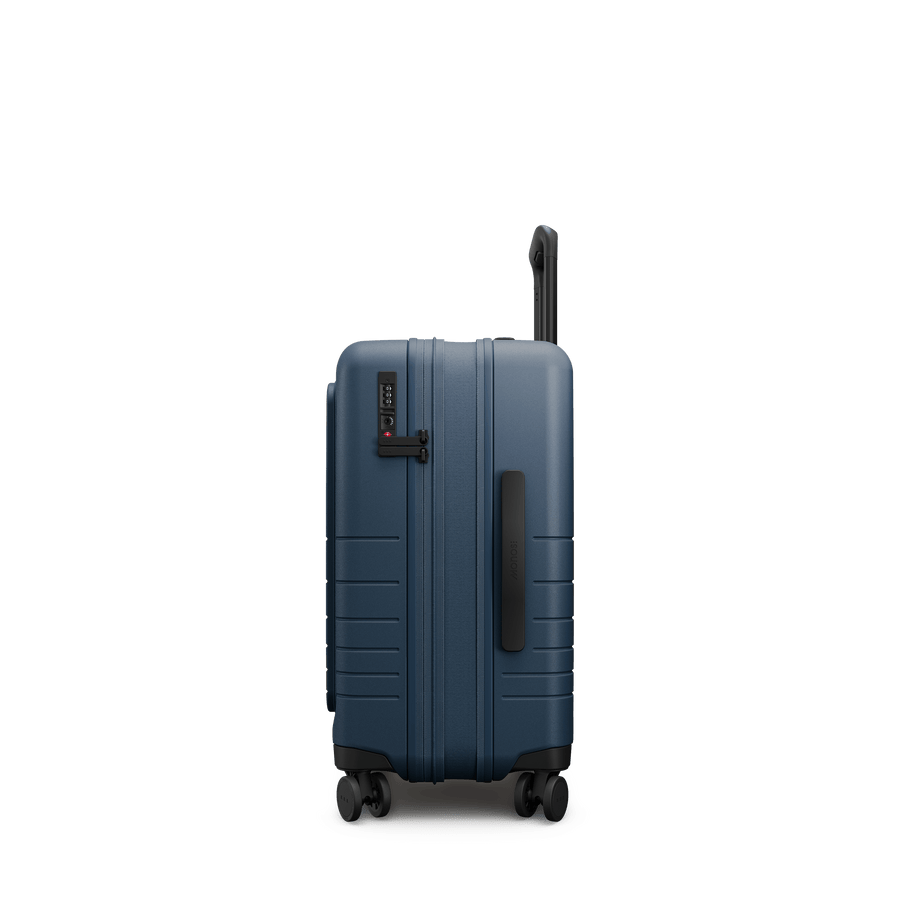 Ocean Blue Hover | Side view of Expandable Carry-On Pro in Ocean Blue