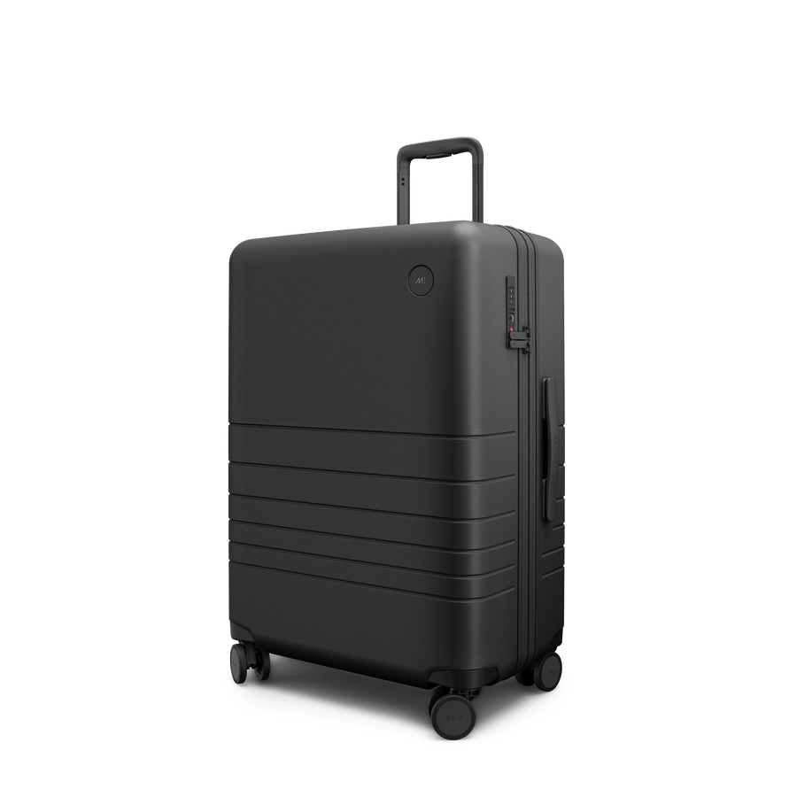 Midnight Black Scaled | Angle view of Expandable Check-In Medium in Midnight Black