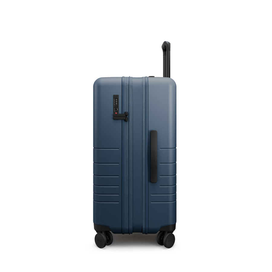 Ocean Blue Hover | Side view of Expandable Check-In Medium in Ocean Blue