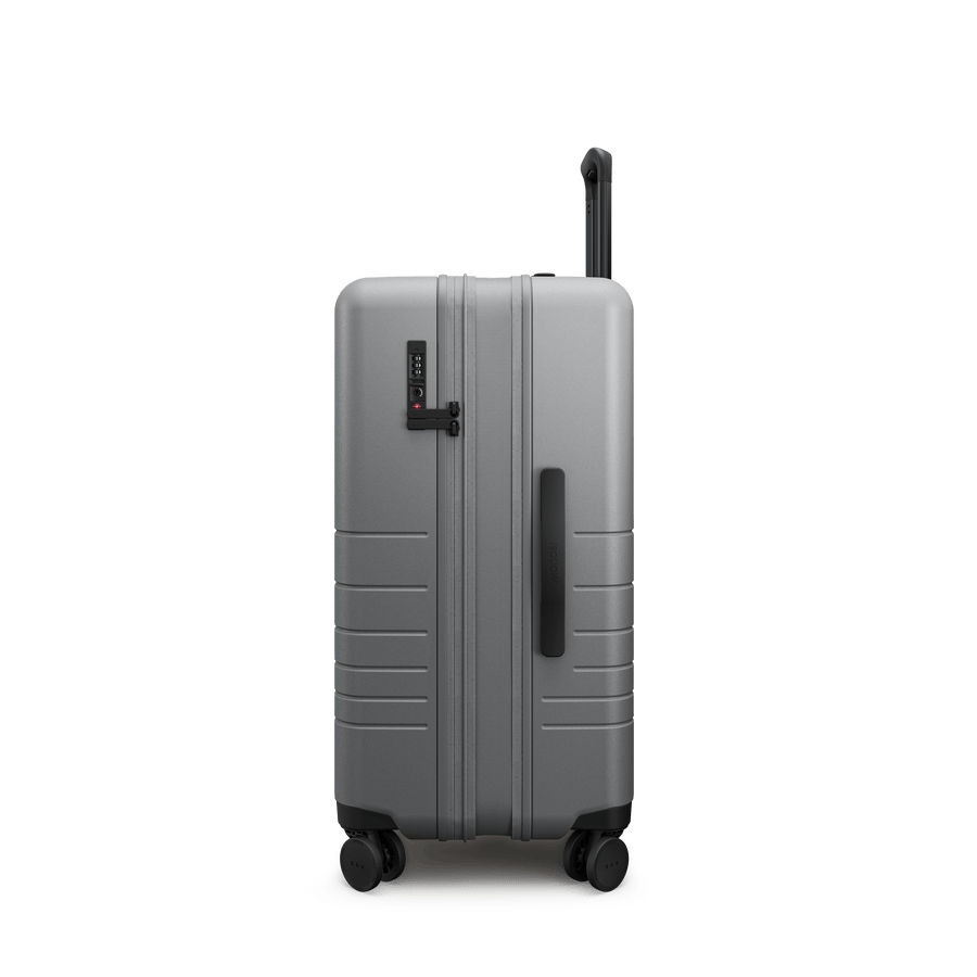 Storm Grey Hover | Side view of Expandable Check-In Medium in Storm Grey