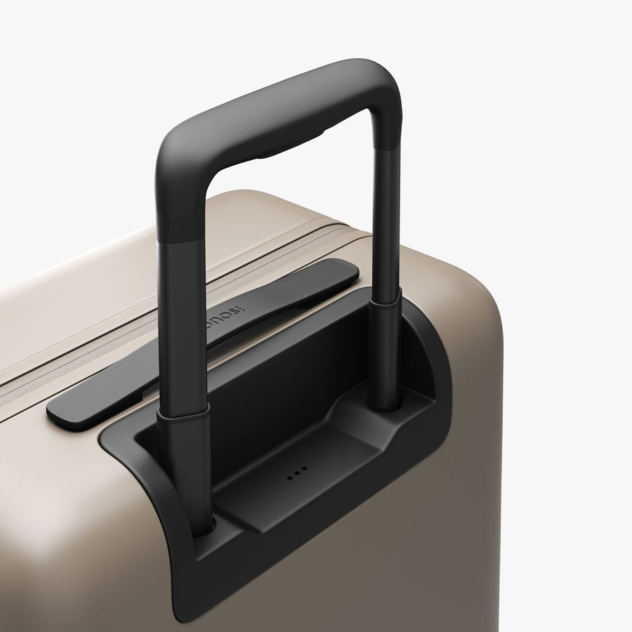 Desert Taupe | Extended luggage handle view of Carry-On Plus in Desert Taupe