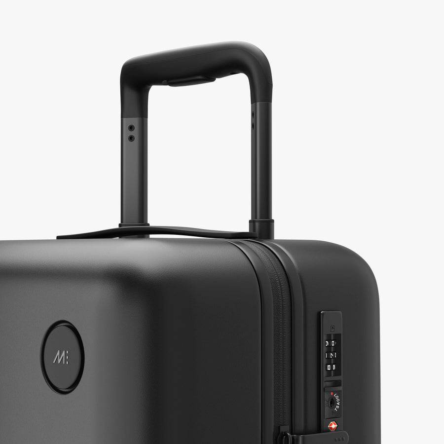 Midnight Black | Luggage handle view of Carry-On Plus in Midnight Black