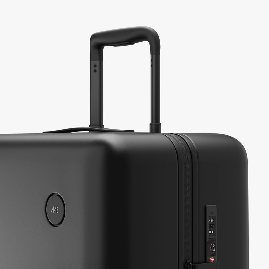 Midnight Black | Luggage handle view of Check-In Large in Midnight Black