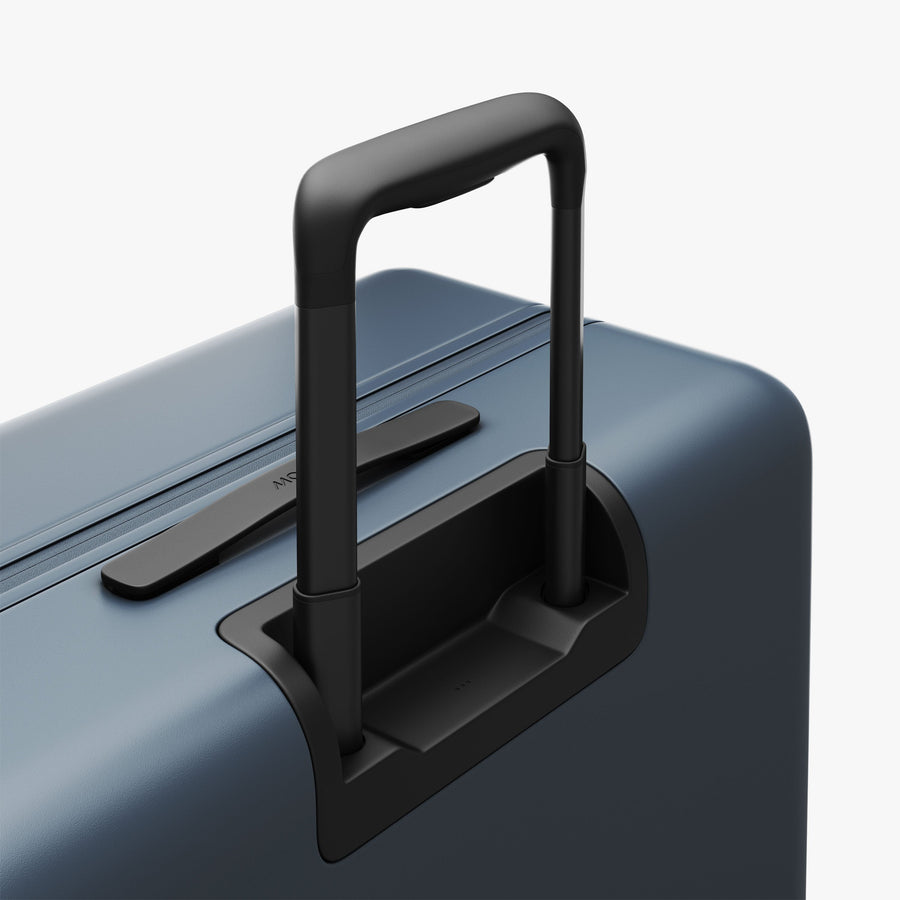 Ocean Blue | Extended luggage handle view of Check-In Large in Ocean Blue