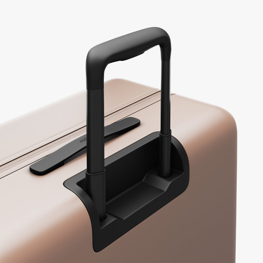 Rose Quartz | Extended luggage handle view of Check-In Large in Rose Quartz