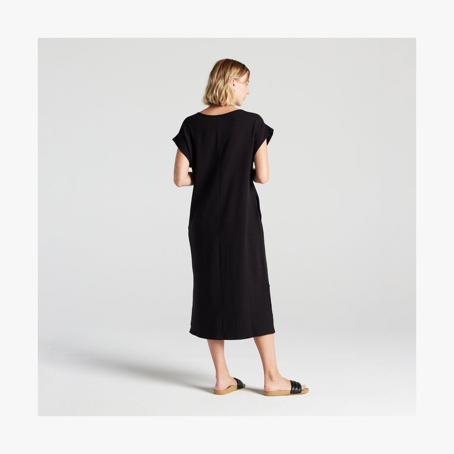 Black | Full body back view of woman in Sevilla Dress Black