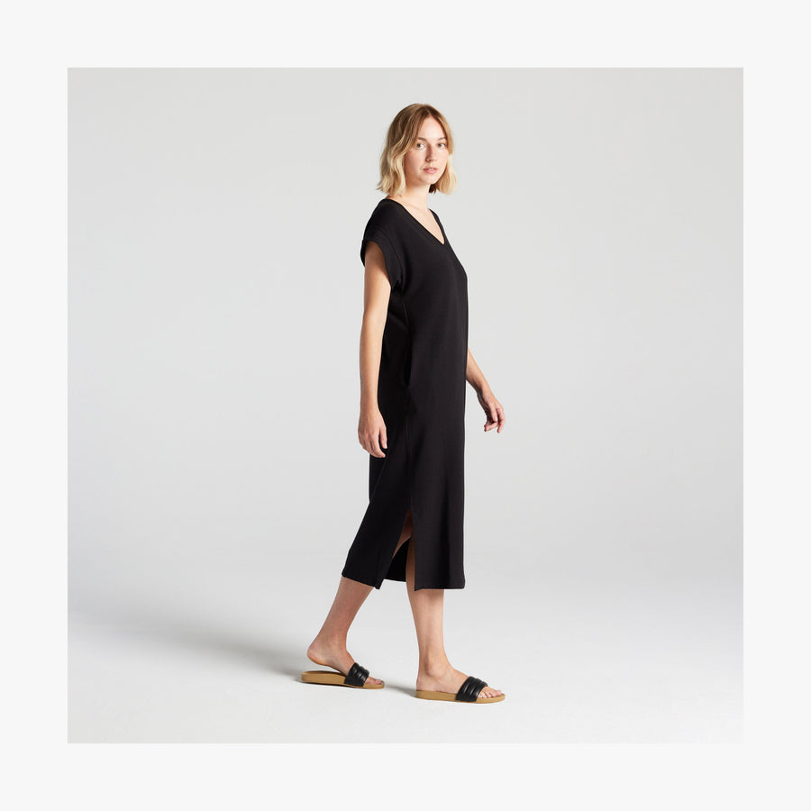 Black | Full body side view of woman in Sevilla Dress Black