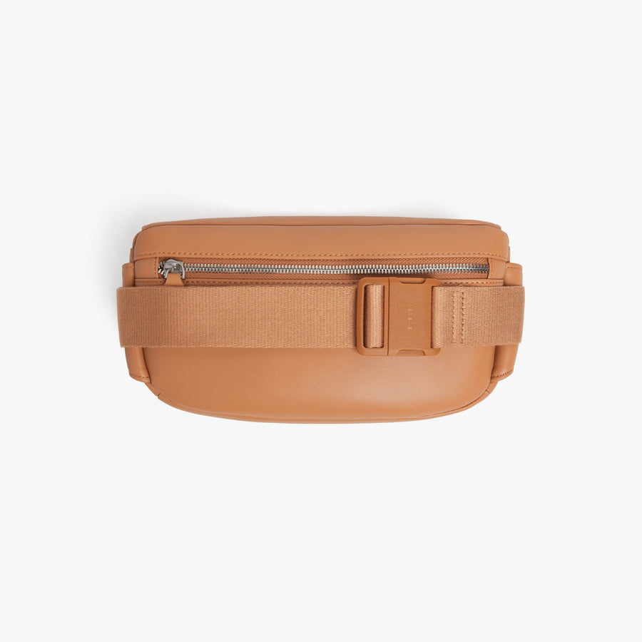 Saddle Tan (Vegan Leather) | Back view of Metro Sling in Saddle Tan