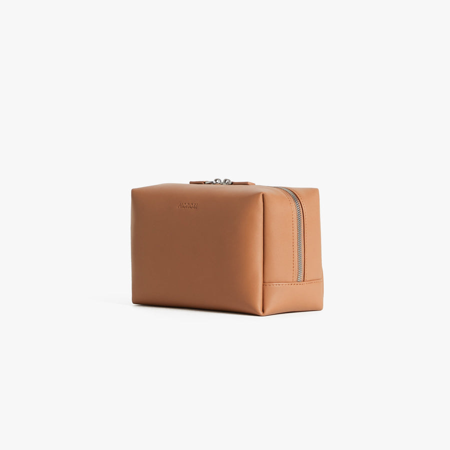 Large / Saddle Tan (Vegan Leather) | Angled view of Metro Toiletry Case Large in Saddle Tan
