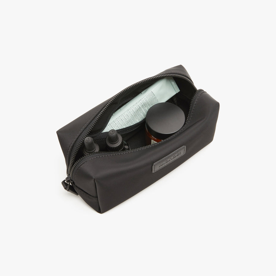 Small / Carbon Black | Interior front view of Metro Toiletry Case Small in Carbon Black