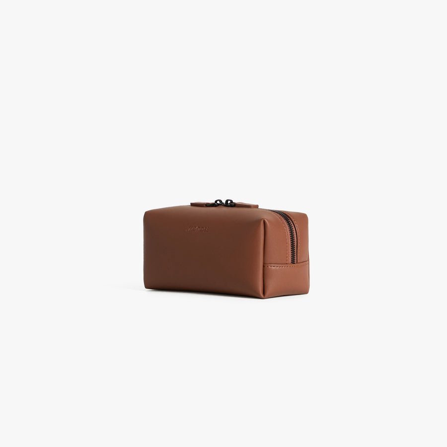 Small / Mahogany (Vegan Leather) | Angled view of Metro Toiletry Case Small in Mahogany