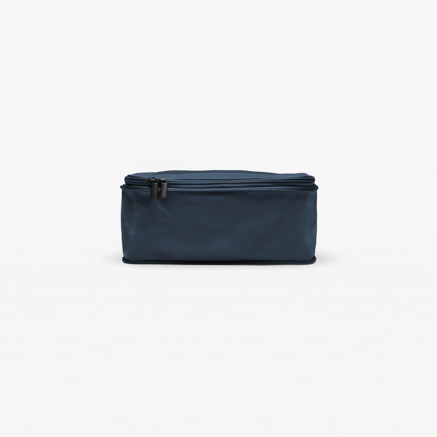 Set of Four / Arles Blue | This is an Arles Blue compressible packing cube gif